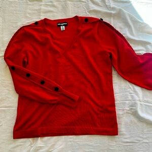 Karl Lagerfeld fine knit sweater in red.
Black felt buttons on outside sleeves